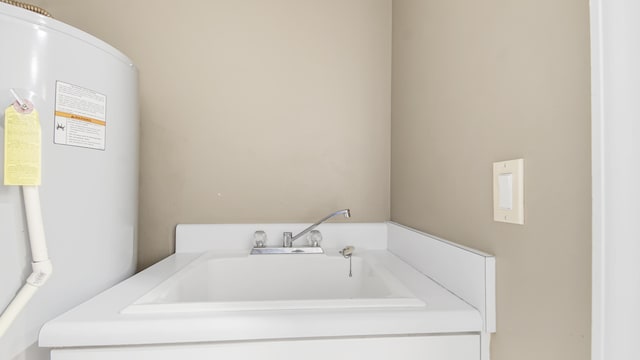 6415 Thomas Dr Unit 1205, Panama City Beach, FL 32408 - bathroom featuring water heater and a sink