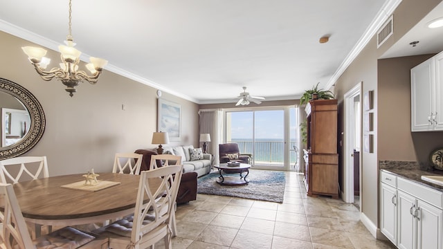 6415 Thomas Dr Unit 1205, Panama City Beach, FL 32408 - dining space with a ceiling fan, crown molding, a water view, and a chandelier