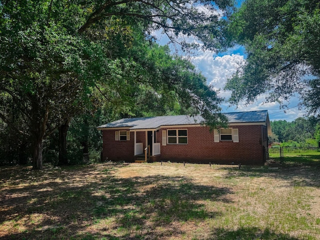 5148 Cavalier Dr, Crestview, FL 32539 - ranch-style house featuring brick siding and a metal roof