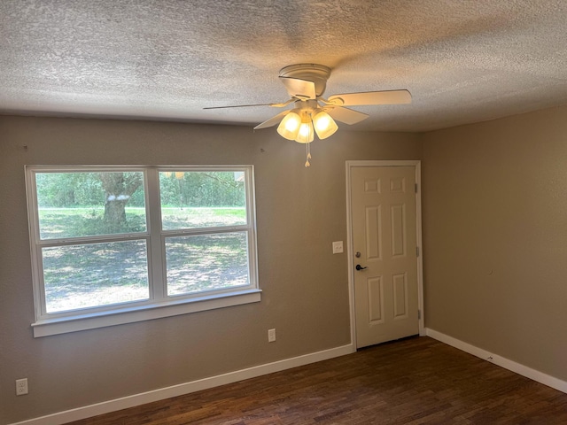 5148 Cavalier Dr, Crestview, FL 32539 - spare room featuring wood finished floors, a textured ceiling, and a ceiling fan