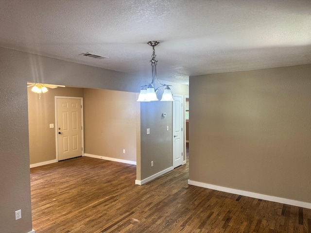 5148 Cavalier Dr, Crestview, FL 32539 - unfurnished room featuring dark wood finished floors, a textured ceiling, and ceiling fan