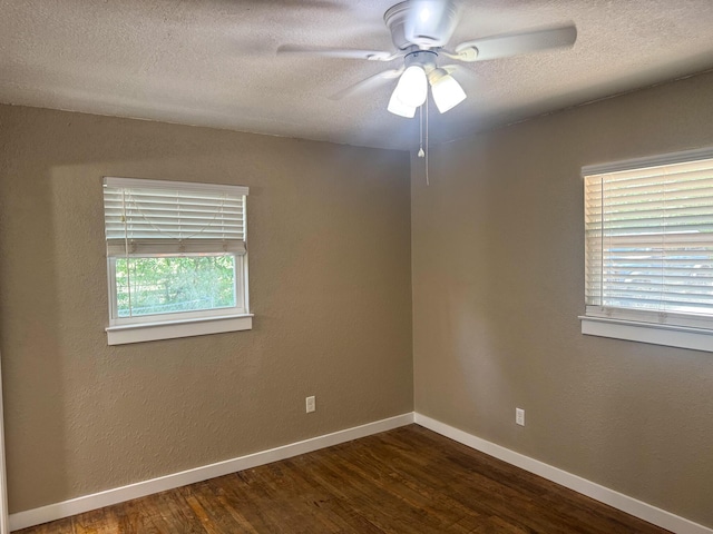 5148 Cavalier Dr, Crestview, FL 32539 - spare room featuring a ceiling fan, dark wood-style floors, and a textured ceiling