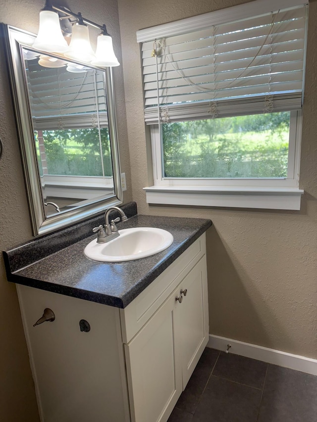 5148 Cavalier Dr, Crestview, FL 32539 - bathroom featuring vanity, a textured wall, and tile patterned flooring
