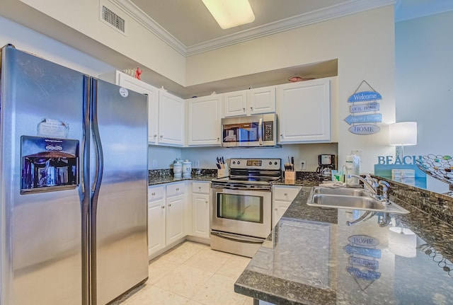16819 Front Beach Rd Unit 2910, Panama City Beach, FL 32413 - kitchen featuring appliances with stainless steel finishes, crown molding, white cabinets, light tile patterned flooring, and a peninsula