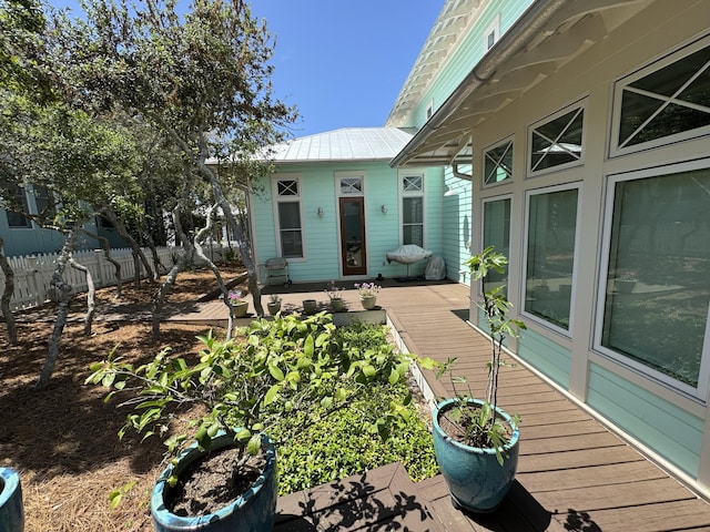 209 Dune Crest Ln, Panama City Beach, FL 32413 - entrance to property with a wooden deck and a metal roof