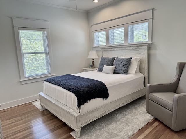 209 Dune Crest Ln, Panama City Beach, FL 32413 - bedroom with multiple windows, wood finished floors, ornamental molding, and recessed lighting