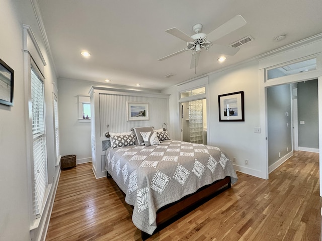 209 Dune Crest Ln, Panama City Beach, FL 32413 - bedroom featuring ornamental molding, wood finished floors, recessed lighting, a ceiling fan, and ensuite bath