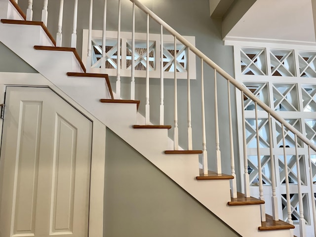 209 Dune Crest Ln, Panama City Beach, FL 32413 - stairs with a high ceiling