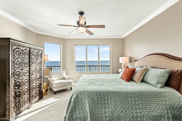 6323 Thomas Dr Unit 904B, Panama City Beach, FL 32408 - bedroom featuring a water view, carpet flooring, multiple windows, ornamental molding, and ceiling fan