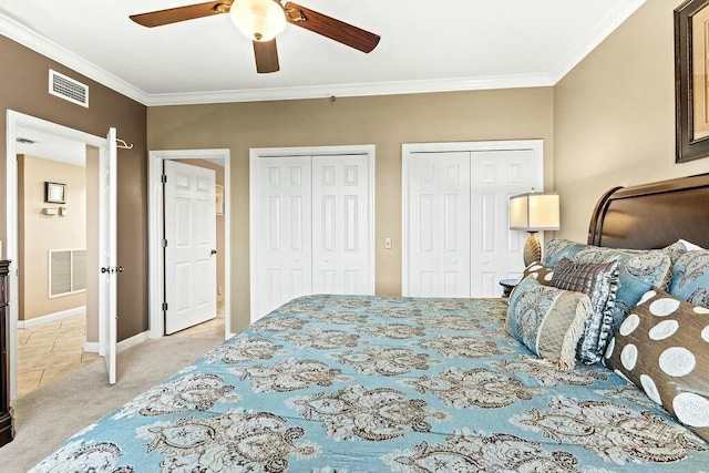 6323 Thomas Dr Unit 904B, Panama City Beach, FL 32408 - bedroom with multiple closets, light colored carpet, ornamental molding, and a ceiling fan