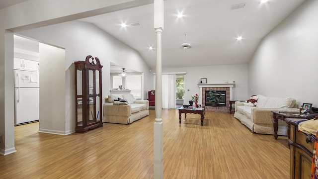 1610 Rhode Island Ave, Lynn Haven, FL 32444 - living area with vaulted ceiling, a fireplace, light wood-style flooring, ceiling fan, and ornate columns