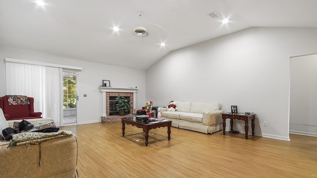 1610 Rhode Island Ave, Lynn Haven, FL 32444 - living room with light wood-style floors, high vaulted ceiling, and a brick fireplace
