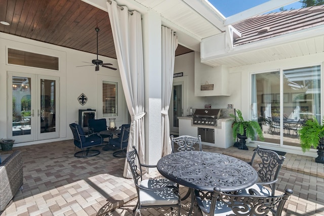 4564 Nautical Ct, Destin, FL 32541 - view of patio / terrace with french doors, outdoor dining area, an outdoor kitchen, and ceiling fan