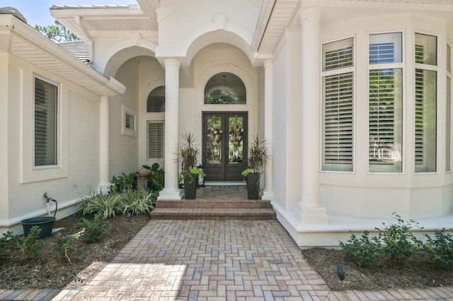4564 Nautical Ct, Destin, FL 32541 - entrance to property with french doors and stucco siding