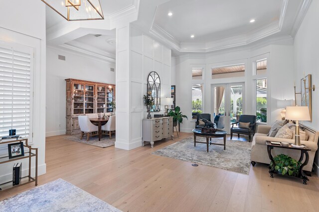 4564 Nautical Ct, Destin, FL 32541 - living room with a high ceiling, crown molding, light wood-style flooring, recessed lighting, and french doors