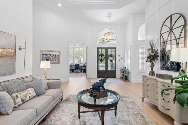 4564 Nautical Ct, Destin, FL 32541 - living area with french doors, a high ceiling, light wood-style floors, ornamental molding, and recessed lighting