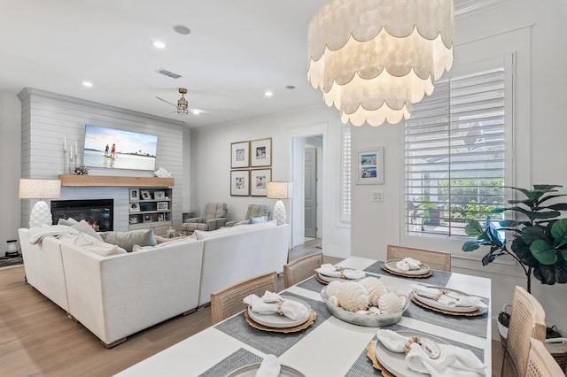 4564 Nautical Ct, Destin, FL 32541 - living area with light wood-style flooring, a ceiling fan, recessed lighting, and a glass covered fireplace