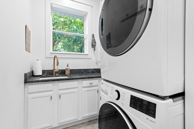 4564 Nautical Ct, Destin, FL 32541 - laundry room with stacked washer / dryer and cabinet space