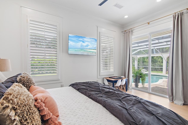 4564 Nautical Ct, Destin, FL 32541 - bedroom with access to exterior, ornamental molding, wood finished floors, and recessed lighting