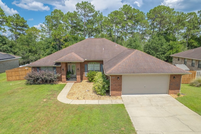 222 Raptor Dr, Crestview, FL 32536 - ranch-style house featuring an attached garage, brick siding, driveway, and roof with shingles