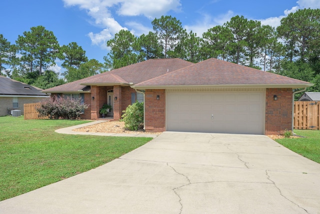 222 Raptor Dr, Crestview, FL 32536 - ranch-style house featuring concrete driveway, an attached garage, and brick siding