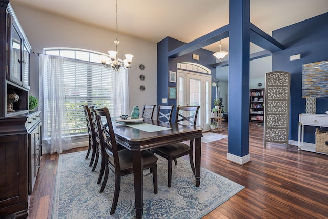 222 Raptor Dr, Crestview, FL 32536 - dining space featuring a chandelier, wood finished floors, and vaulted ceiling