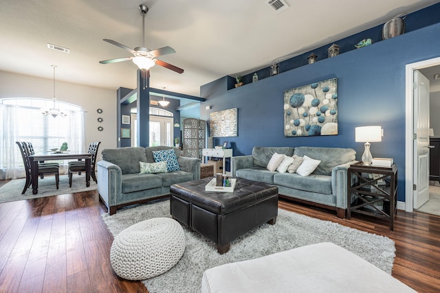 222 Raptor Dr, Crestview, FL 32536 - living room featuring a chandelier, wood finished floors, ceiling fan, and vaulted ceiling