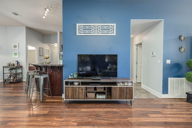 222 Raptor Dr, Crestview, FL 32536 - living area featuring wood finished floors and rail lighting
