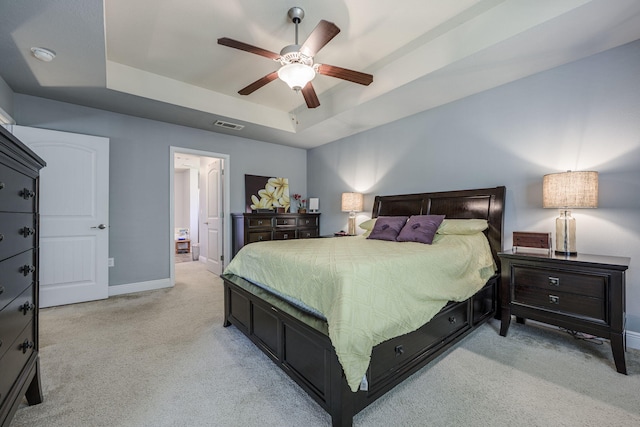 222 Raptor Dr, Crestview, FL 32536 - bedroom with a raised ceiling, light colored carpet, and a ceiling fan