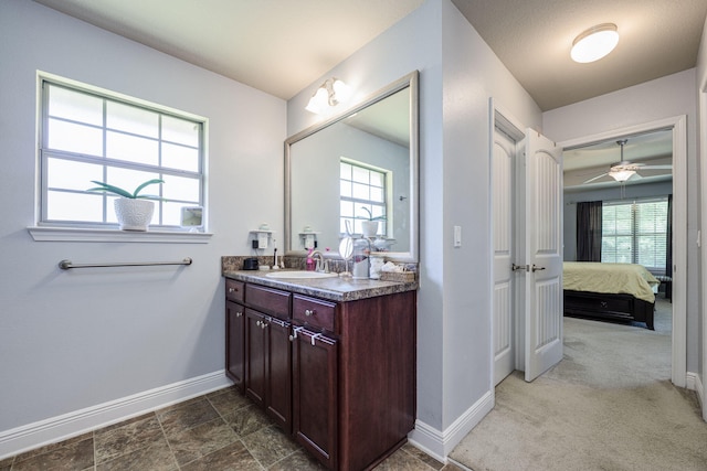222 Raptor Dr, Crestview, FL 32536 - ensuite bathroom featuring vanity, healthy amount of natural light, and ceiling fan