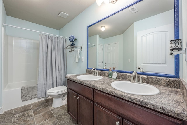 222 Raptor Dr, Crestview, FL 32536 - full bath featuring double vanity, shower / tub combo, and stone finish flooring