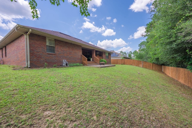 222 Raptor Dr, Crestview, FL 32536 - back of property with a fenced backyard, brick siding, and a patio