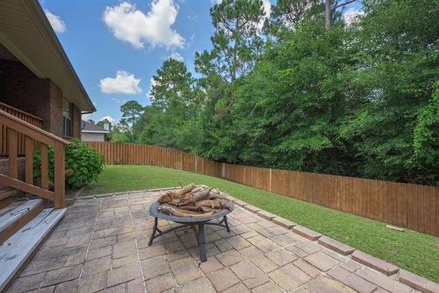 222 Raptor Dr, Crestview, FL 32536 - fenced backyard featuring a patio area and a fire pit