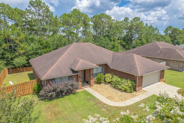 222 Raptor Dr, Crestview, FL 32536 - ranch-style house featuring brick siding, concrete driveway, an attached garage, and a shingled roof