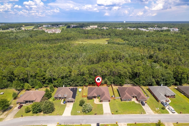 222 Raptor Dr, Crestview, FL 32536 - aerial perspective of suburban area featuring a heavily wooded area