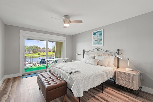 210 Pelham Rd Unit 211B, Fort Walton Beach, FL 32547 - bedroom with access to exterior, wood finished floors, a ceiling fan, and a water view
