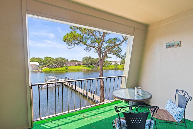 210 Pelham Rd Unit 211B, Fort Walton Beach, FL 32547 - balcony featuring a water view and a dock
