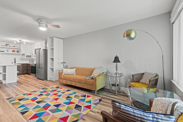 210 Pelham Rd Unit 210B, Fort Walton Beach, FL 32547 - living room with light wood-style floors and ceiling fan