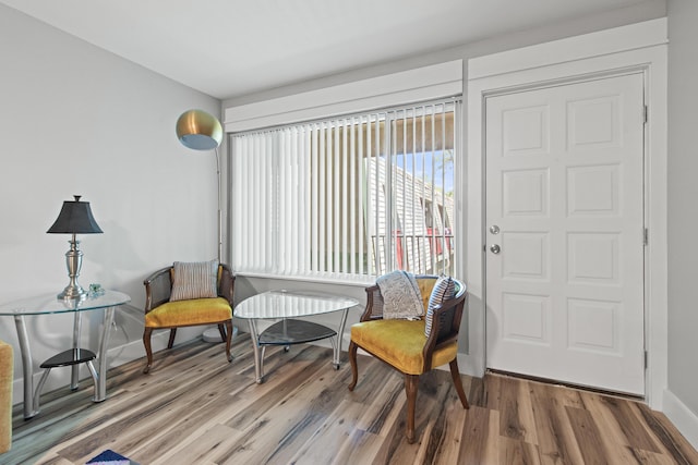 210 Pelham Rd Unit 210B, Fort Walton Beach, FL 32547 - sitting room with wood finished floors and baseboards