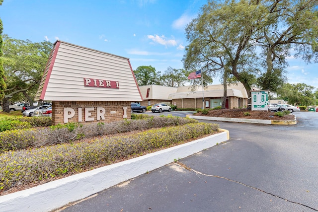 210 Pelham Rd Unit 210B, Fort Walton Beach, FL 32547 - view of building exterior with uncovered parking