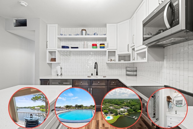 210 Pelham Rd Unit 210B, Fort Walton Beach, FL 32547 - kitchen featuring stainless steel microwave, open shelves, decorative backsplash, light countertops, and white cabinetry