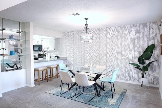 34 5th Ave Unit A, Shalimar, FL 32579 - dining room featuring light carpet and wallpapered walls