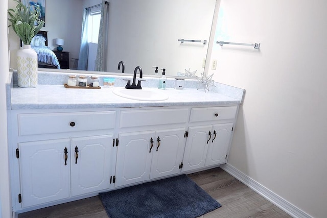 34 5th Ave Unit A, Shalimar, FL 32579 - ensuite bathroom featuring vanity and wood finished floors