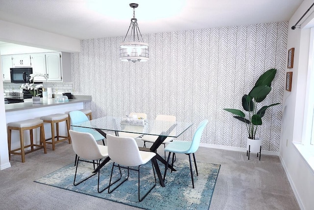 34 5th Ave Unit A, Shalimar, FL 32579 - dining area featuring light carpet and wallpapered walls