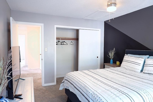 34 5th Ave Unit A, Shalimar, FL 32579 - bedroom featuring carpet flooring, a closet, a textured ceiling, and attic access