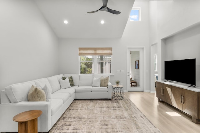 8450 Dreams Float Ct, Panama City Beach, FL 32413 - living room with healthy amount of natural light, a ceiling fan, light wood-style floors, high vaulted ceiling, and recessed lighting