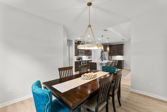 8450 Dreams Float Ct, Panama City Beach, FL 32413 - dining room featuring light wood finished floors and recessed lighting
