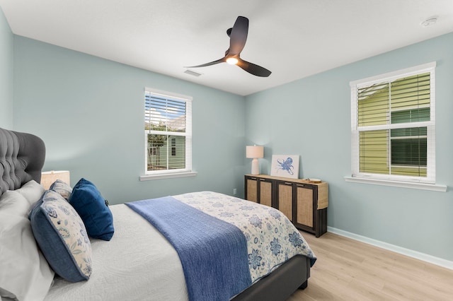 8450 Dreams Float Ct, Panama City Beach, FL 32413 - bedroom featuring wood finished floors and ceiling fan
