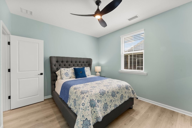 8450 Dreams Float Ct, Panama City Beach, FL 32413 - bedroom with light wood finished floors and a ceiling fan