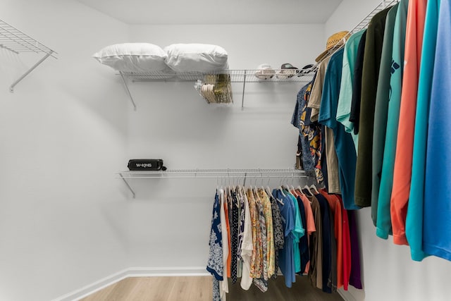 8450 Dreams Float Ct, Panama City Beach, FL 32413 - walk in closet with wood finished floors